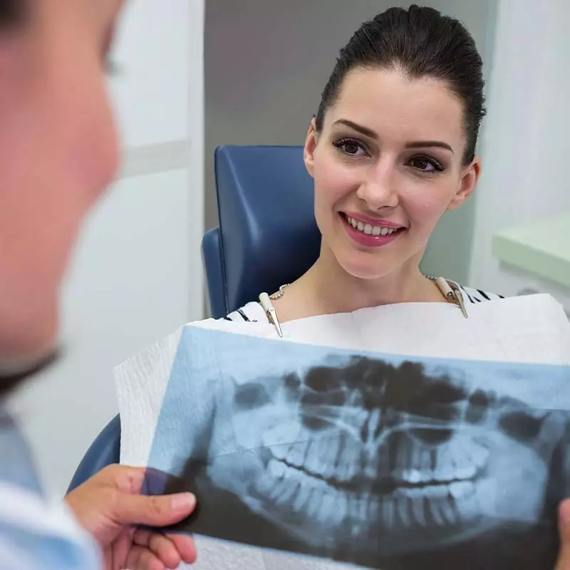 dentist-discussing-with-patient-x-ray-report-Miami-Dentists dentist discussing with patient x ray report Miami Dentists